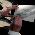 Infiniti executive design director Habib makes a freehand sketch of the QX Inspiration for attendees at a media reception ahead of the North American International Auto Show in Detroit