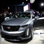 Members of the media look at General Motors 2020 Cadillac XT6 SUV after it was revealed on the eve of press days of the North American International Auto show in Detroit