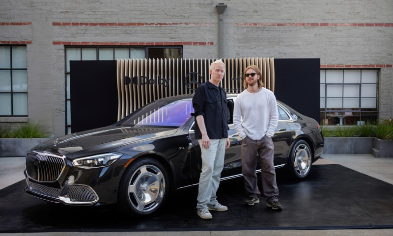 Aron Forbes and FINNEAS standing next to a Marcedes Maybach at the Crafted in a Mercedes event.