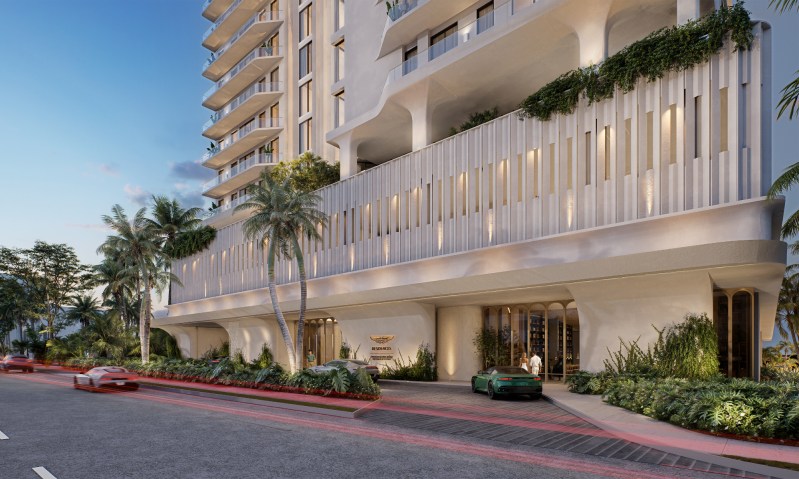 Aston Martin Residences Daytona Beach Shores front view with a couple walking to the entrance.