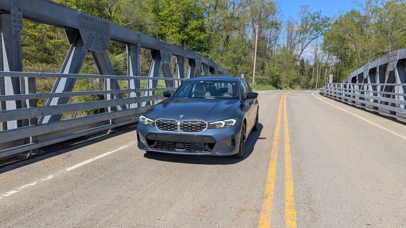 BMW M340i Front view driving across a bridge